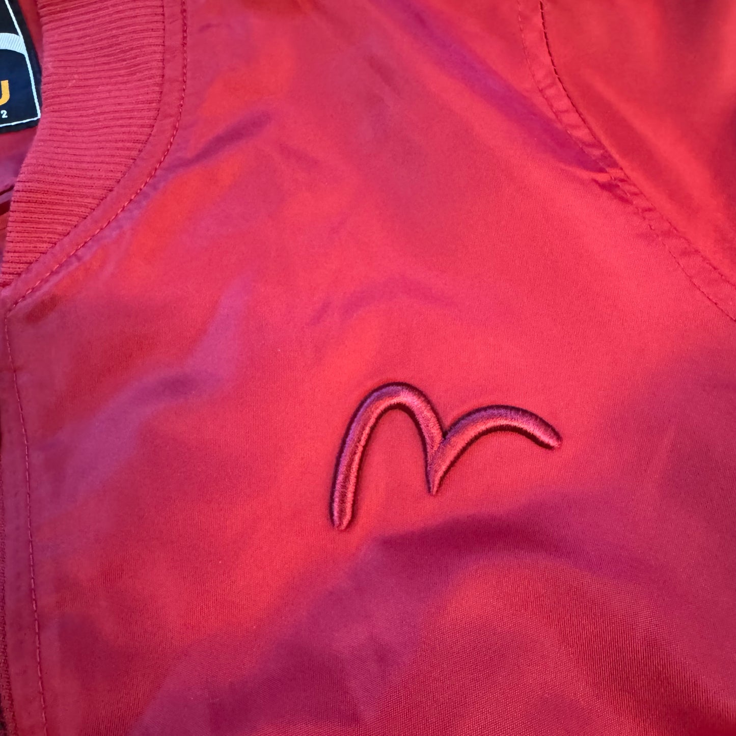 Evisu Alphabet red bomber raincoat