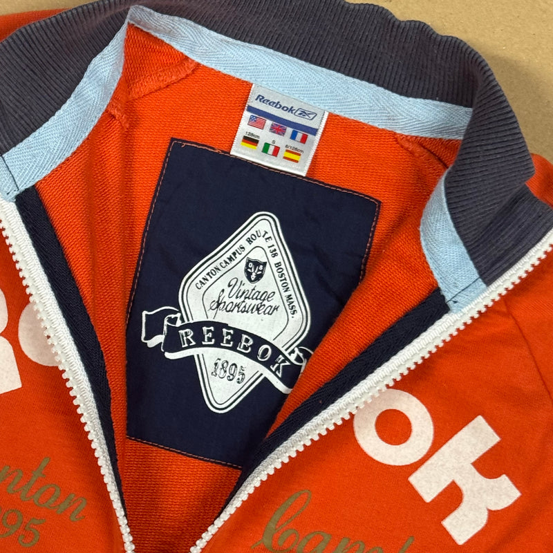 Detailansicht: Sourced limited accessories and clothes Reebok orange vintage zip-up – Logo, Nähte oder Material