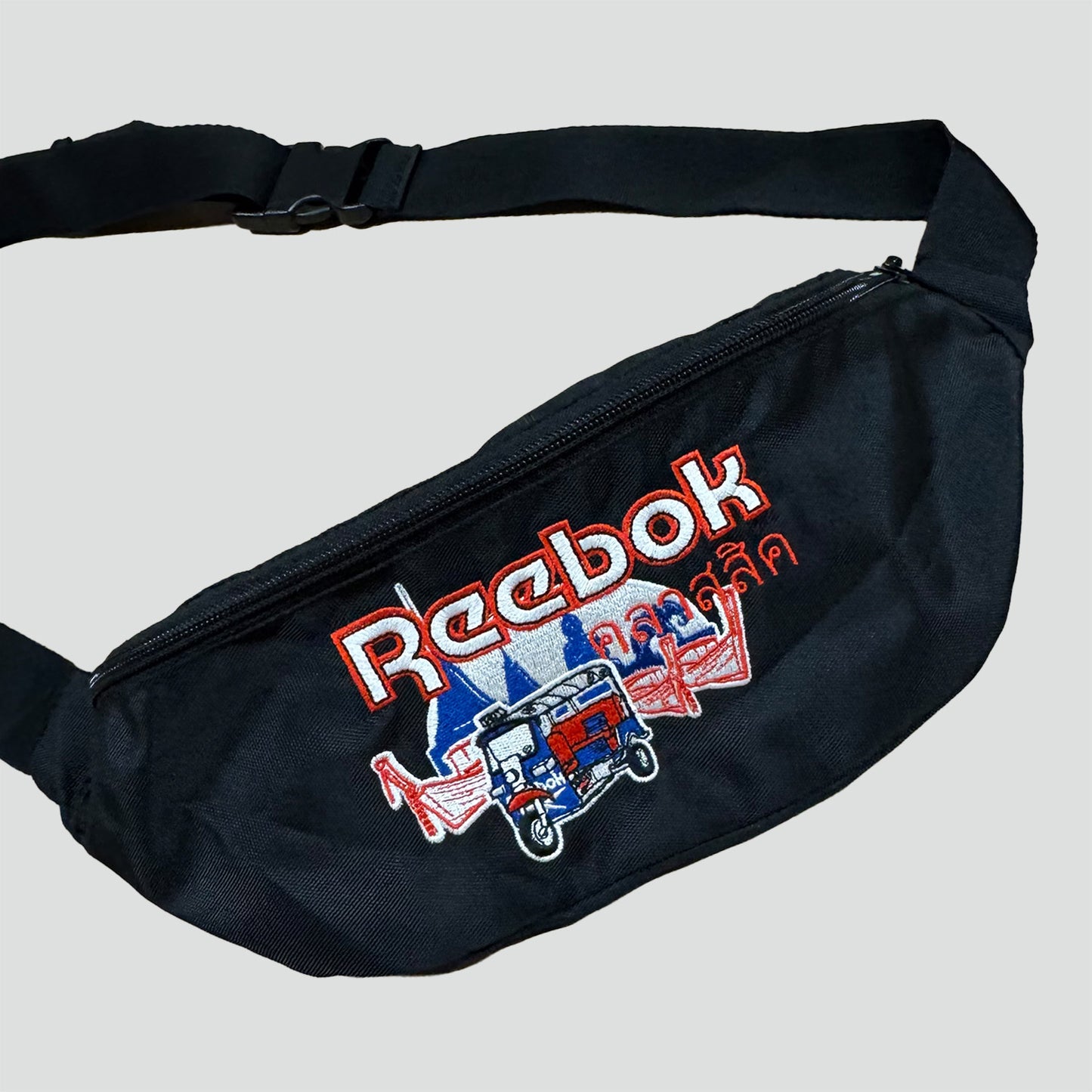 Reebok stitched black waist bag