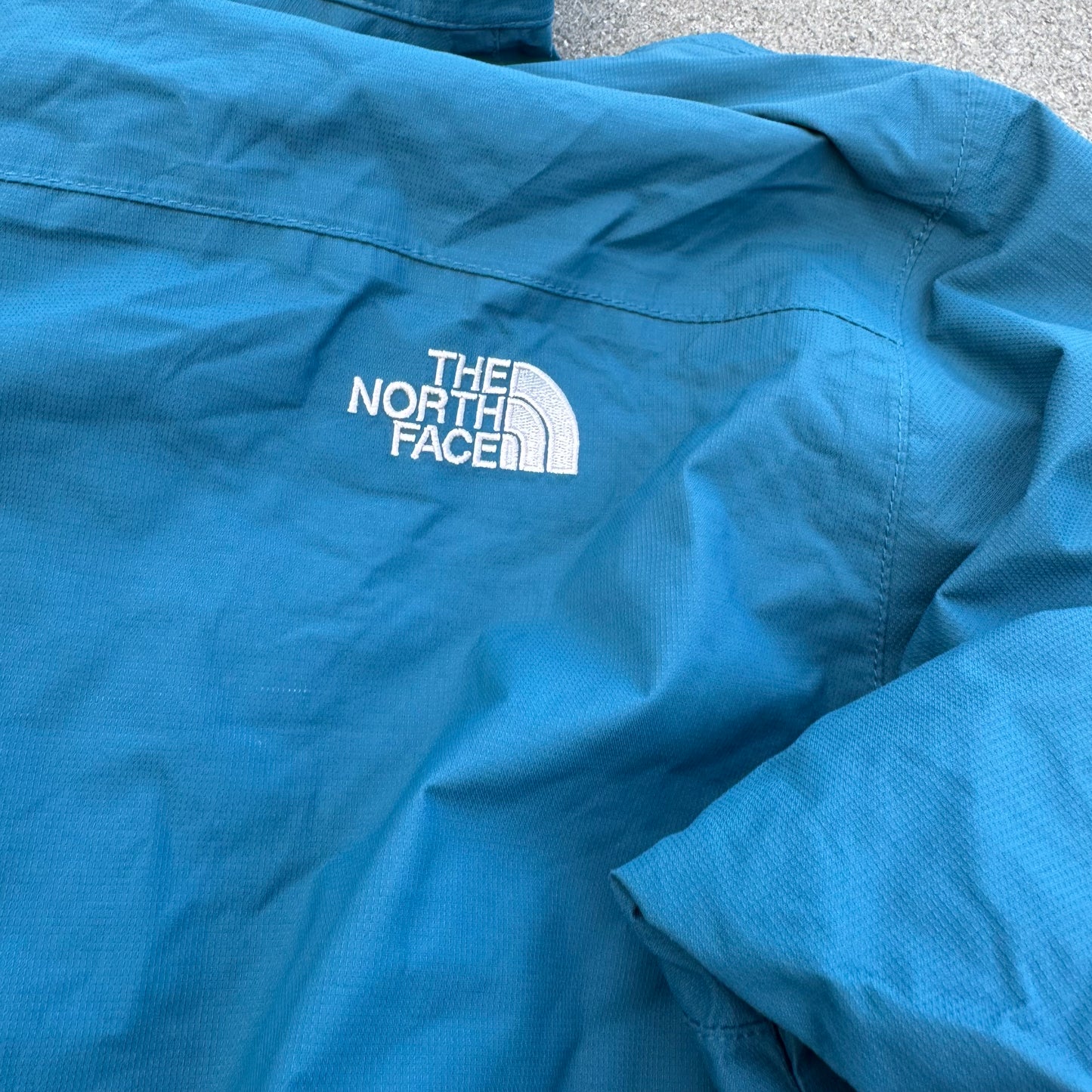 The North Face blue rain jacket