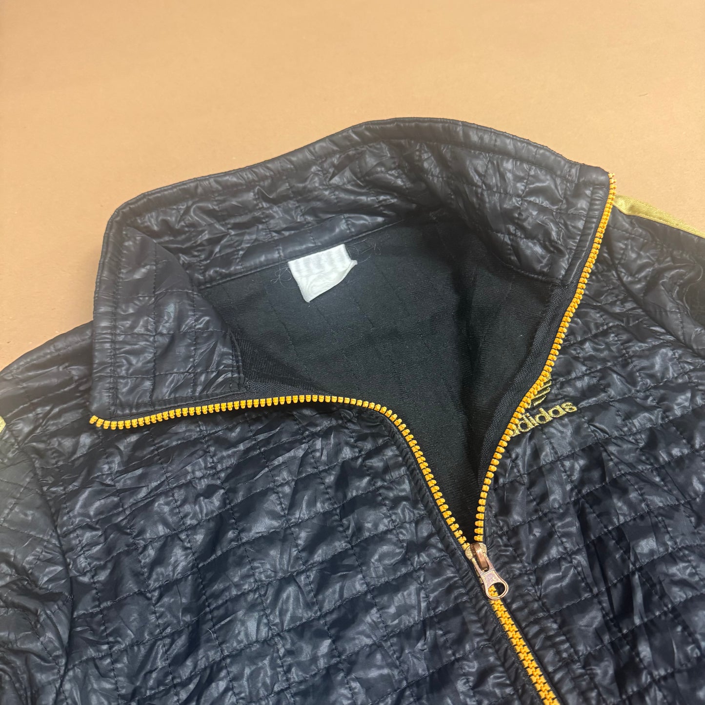 Adidas y2k-style black and golden rainjacket