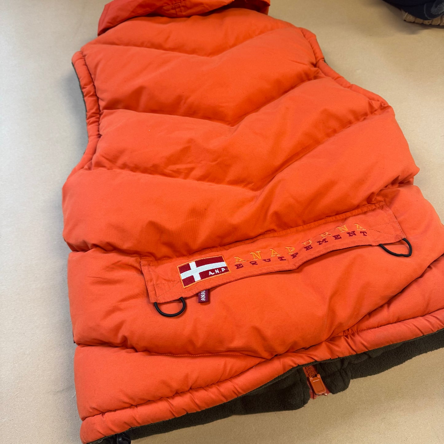 Anapurna orange puffer vest