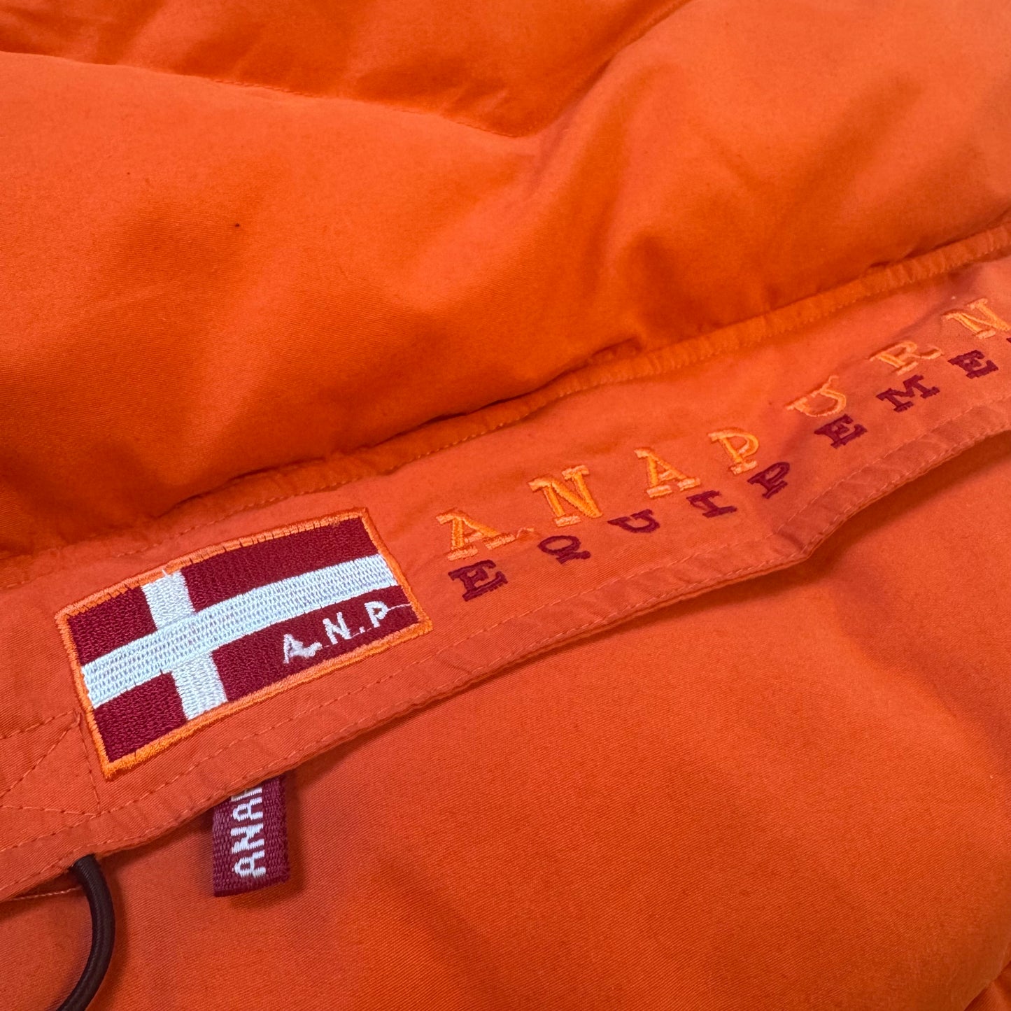 Anapurna orange puffer vest