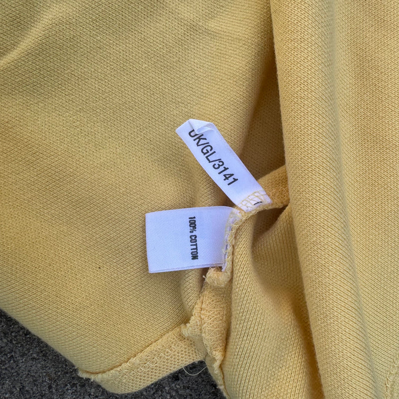 Detailansicht: Sourced limited accessories and clothes Yves Saint Laurent vintage yellow poloshirt – Logo, Nähte oder Material
