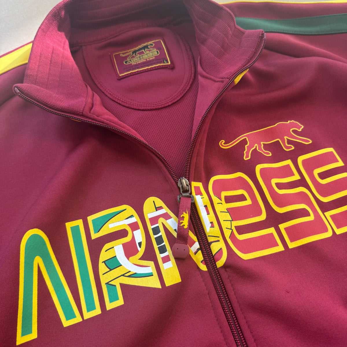 Airness burgundy streetwear football track jacket – Close-up 1