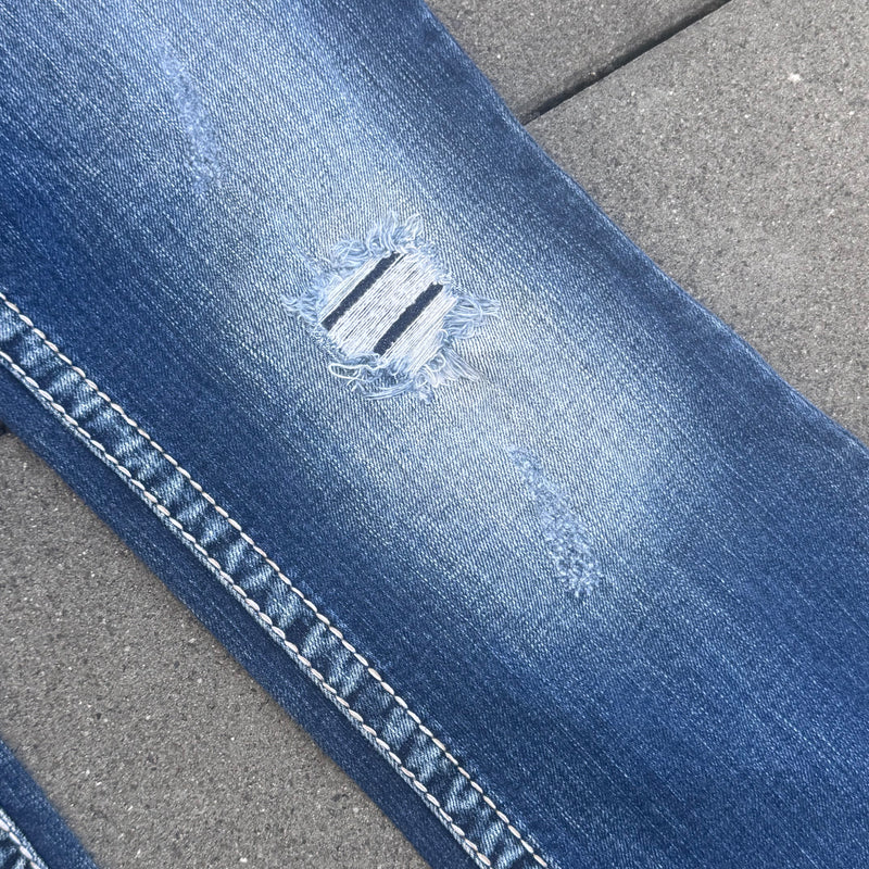 Detailansicht: Sourced limited accessories and clothes Silven y2k bootcut ripped denim jeans – Logo, Nähte oder Material