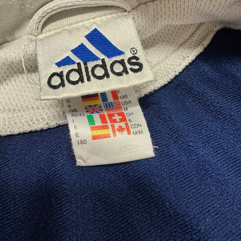 Detailansicht: Sourced limited accessories and clothes Vintage 90s Adidas blue track jacket – Logo, Nähte oder Material